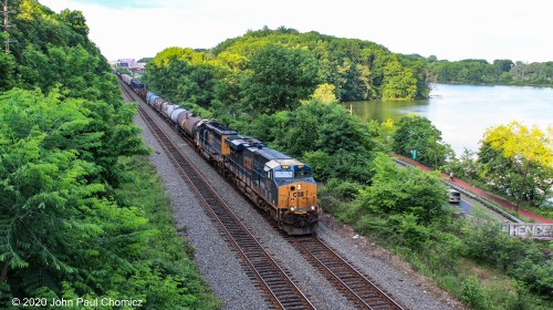 I don't know which one it is but this is a westbound CSX Q-train, running on the Lehigh Line, at Weequahic Park, in Newark, NJ.