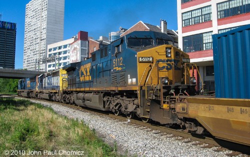 This passing shot of the northbound intermodal shows us better view of a standard cab unit, still in the, "Bright Future", livery. It is sandwiched between two units with the, "Dark Future", livery. This photo was taken at Schuylkill Park, in Philadelphia, PA.