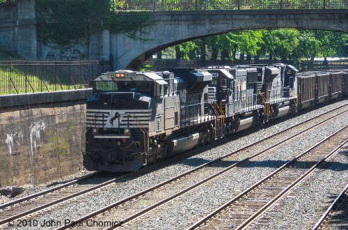 A loaded westbound coal train waits in the cut, at Allegheny Commons Park, in Pittsburgh, PA.