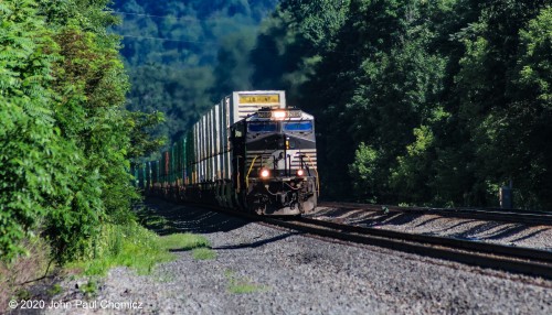 ......Loaded up and, uh, "Training"? An eastbound intermodal train passes through Newport, PA.