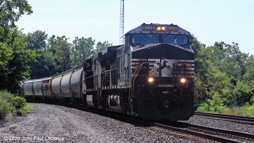 The haze around the headlights of this eastbound mixed freight gives away the fact that it was a very hot, humid day in Thompsontown, PA.