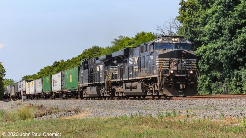 An eastbound, "hot", intermodal train flies through Newport, PA on this scorchingly, hot day.