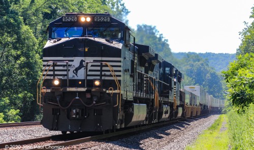 The wind kicked up by this westbound intermodal train was very welcome on this scorching morning in Newport, PA.