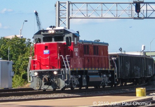 DGNO 2GS14B #: 140  passes through Dallas Union Station with a local freight in tow. Not the greatest shot but it was unexpected and taken with my trusty old point and shoot.