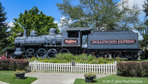 Baldwin 2-8-0 Steamer #: 107 was built for the East Tennessee, Virginia, and Georgia Railroad switched to Southern Railway and, finally, ended its career when the Smoky Mountain Railroad bought it. It now serves as a display for the, "Dollywood Express", at Dollywood, in Pigeon Forge, Tennessee.