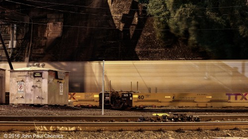 This really is a random night shot. It is a photo of a mixed freight train passing some empty well cars, one night in Portland, Oregon. I set it up as a test shot, for taking night shots of the skyline behind me, but it came out so well and nicely lit that I included it on this site.