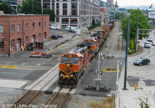 Downtown Seattle is a very interesting railfanning location as the trains run right alongside of downtown, near the Space Needle. In this case, it's a northbound BNSF mixed freight, as it crosses Broad Street.