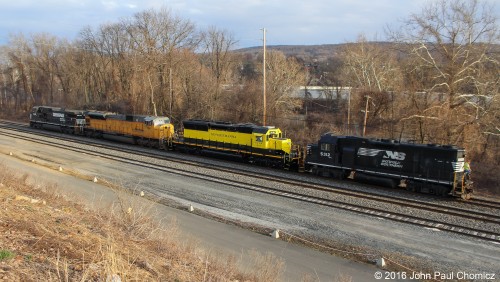 This power move consists of NYS&W #: 3016, which was originally built as a UP SD40T-2, newly rebuilt as an SD32ECO, and NS #: 7314, a SD9043MAC that was recently acquired from UP. The move is headed west into Allentown Yard by a local yard crew.