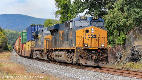 Just the slightest touch of color on the trees, as this southbound CSX intermodal train passes through Tomkins Cove, NY.