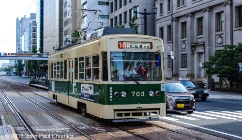 The 1-Line is one of the few routes of the Hiroshima Electric Railway. It is the busiest and longest streetcar service in Japan. Here, the streetcar is bound for the Port of Hiroshima.