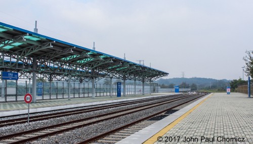 A track side view of the empty platforms of Dorasan Station, from the southbound platform. The northbound platform is on the left and the view is of the tracks heading towards North Korea. This is the last stop on the DMZ before heading into Kaesong, North Korea.