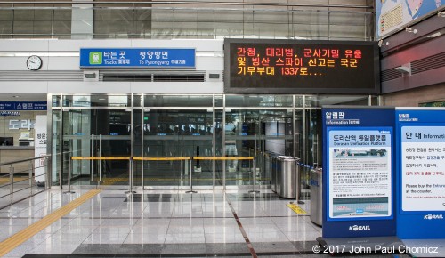 Dorasan Station, in South Korea, was built in 2002 with hopes of re-establishing rail service between the north and south. This never materialized and here the doors to the north-bound platform are taped off. No passengers utilize this station and it remains as a museum of sorts, on the tour of the DMZ.