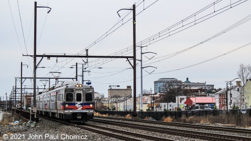 With the downtown skyline in the background, a Philadelphia-bound SEPTA train departs the Norristown Transportation Center, in Norristown, PA.