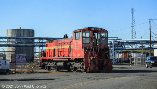 The EJRR #: 321B crosses the Hook Road and back into the main portion of the terminal of IMTT Bayonne.