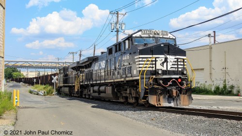 The ballast train was pulled to the southern end of the Constable Hook Industrial Track. Behind me, the track extends about thirty more feet before it hits the gate of Gordon's Terminal, which is the last customer on the line. At this time, the train extended the entire length of the southern portion of the Constable Hook Industrial Track and was blocking every crossing along the way. I don't know how much further west of the first Hook Road crossing the train extended but I know it did cause a traffic jam on this normally smooth flowing and lightly trafficked road. Conrail dispatched an entire fleet of maintenance of way trucks to guard each crossing.