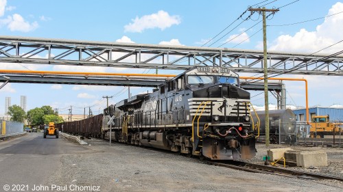 After clogging up the entire Hook Road, the train finally shoves back north towards the Bayonne Industrial Track, ending a move which was a first for many reasons: 1) The first time large, high-horsepower main line units, came down this track. 2) The first time a train, this large, has ever come down this track. It extended the entire length of the Hook Road and blocked all crossings, simultaneously. 3) It was the first time a main line unit train has ever come down this track. 4) It was the first time a train with any other cars, other than tank cars, has come to this portion of the track. As it shoves, it passes an area that usually only sees a few locals and the terminal railroad puttering around.