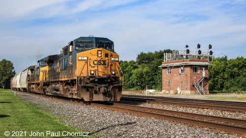 A CSX mixed freight train passes the Berea Tower as it heads east on the Indianapolis Line in Berea, OH.