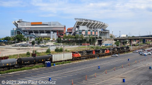 A few hours after seeing this eastbound tank train pass through Berea, it now passes the First Energy Stadium with NS power leading it along the lakefront, in Cleveland, OH.