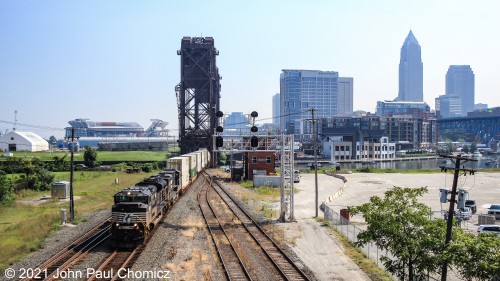 Trying to make the best of the morning light, I switched angles a bit to get the better lit side of a westbound doublestack train as it crossed the Cuyahoga River with downtown Cleveland, as a backdrop.