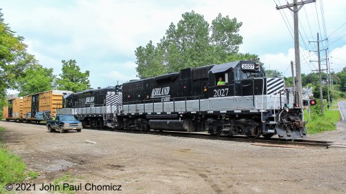 In a stroke of pure luck and good timing, just as I was completing my tour of the Ohio State Reformatory (Shawshank Prison), I heard the sound of train horns approaching. I was able to race to the nearest railroad crossing and found this short Ashland Railway local, as it crossed East Longview Avenue, just down the road from the Reformatory. If you are familiar with the movie Shawshank Redemption, there were a few scenes in which train horns are heard in the background during the prison yard scenes with Andy Dufresne. The horns were the horns of the Ashland Railway which passes the prison a short distance north of this location.