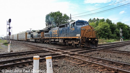 After working Marion Yard and putting a halt to all railroad action, for an hour, this CSX autorack train crosses the quad diamond of the CSX Toledo Line and heads east on the Indianapolis Line, at Marion, OH.