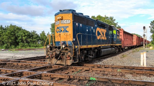 A CSX Marion Yard local crosses the quad, over the NS Sandusky Subdivision, as it heads west back into Marion Yard, at Marion, OH.