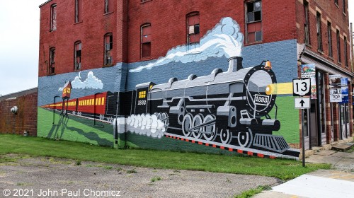 The photograph is mine but, once again, not my artwork. This fun little train mural is painted on the side of a building at the corner of North Main and Olive Street, in Mansfield, Ohio.