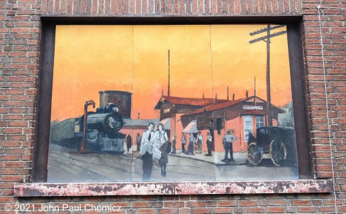 The photograph is mine, unfortunately, this beautiful painting is not. This is a painting of the old B&O Mansfield Depot. This painting hangs on a building at the corner of West 3rd Street and North Main Street in downtown Mansfield, Ohio.