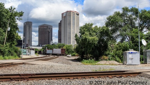 This short NS local, out of Watkins Yard, heads east towards the Scioto River Bridge, in Columbus, OH. Some of the skyline of downtown Columbus can be seen in the background.