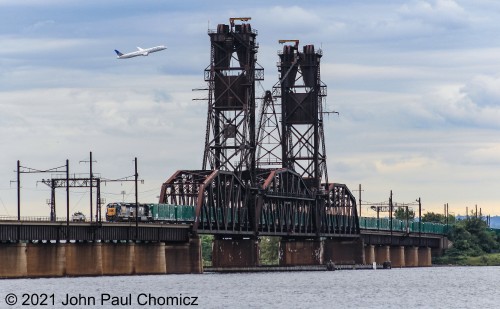 Yep, we got all three covered: The Oak Island Local shoving garbage cars down into the bowl, the United 787 "Dreamliner" taking off out of EWR, and the tiny track car following the local back into the yard. Good timing.