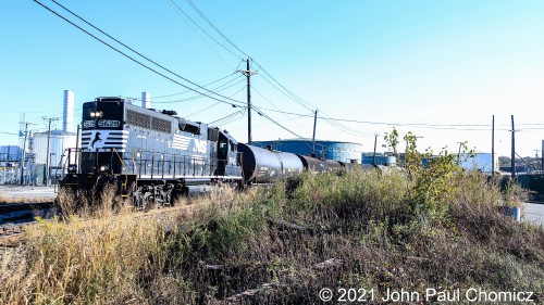 The Conrail Bayonne Local has just got done pulling empties out of Gordon's Terminal and heads up the Hook Road back to Bayonne Yard.