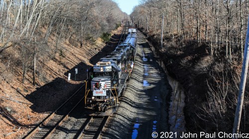 After waiting for a Hoboken bound Metro North Train to pass, the Toys for Tots train was given clearance to exit the old L&HR trackage and enter the Southern Tier. Here, it has just entered the Southern Tier as it nears its next stop at Campbell Hall, NY.