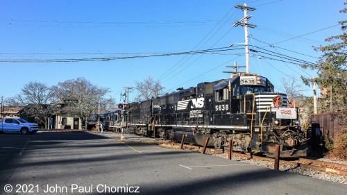 The 2021 Toys for Tots Train arrives at its first stop of the day in Warwick, NY. The train passes the Warwick Station as it pulls to a stop across South Street.