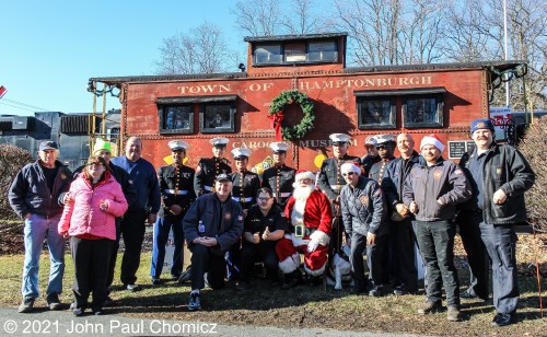 Santa Claus is in good company as he poses with his entourage of Marine Corps bodyguards and members of the local fire department that made this Toys for Tots train stop possible. Here, they are posing in front of the Caboose on display at the Town of Hamptonburgh Caboose Museum in Campbell Hall, NY. MERRY CHRISTMAS TO ALL THE FELLOW TRAINNUTZ ON THIS SITE!