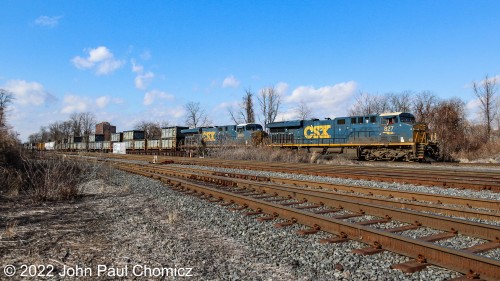 When the sun was shining bright, two dark future liveried engines appeared with a northbound Q-Train on the National Docks Secondary in Jersey City, NJ.