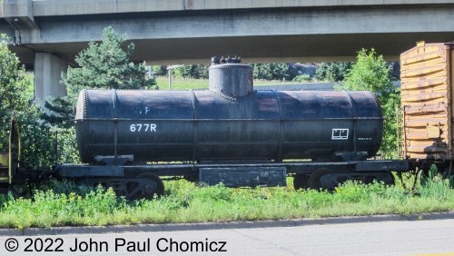 This tank car is one of the other pieces of equipment that sits stored alongside the road right next to the Erie Mining Company Baldwin. This is a Northern Pacific single dome tank car that is also owned by the Lake Superior Railroad Museum in Duluth, MN. According to the markings, this car was built in October 1917. Photo taken in 2012.