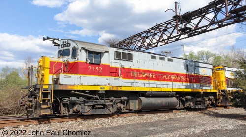 Delaware and Lackawanna Unit #: 2452 comes passes under an old DL&W signal bridge somewhere near East Stroudsburg, PA. This pic was taken in 2015 during the times when it was easier to see and chase the D & L down past Pocono Summit, PA.