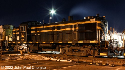 The D & L #: 1554 Jersey Central Unit is tied up for the night amidst a string of other D & L units on a freezing cold night in Scranton, PA. This photo was taken in February 2018.