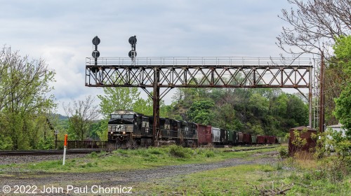 An NS grain train passes under the old signal bridge in Easton, PA as it heads back to Allentown Yard. There is a close-up photo of this same train that I previously posted on this website as it was passing over the Easton Station. At the time, I thought that photo was more interesting but now I think this one is better because it gives a better sense of the overall scenery.....Not to mention that that signal bridge has been replaced with a modern signal bridge.