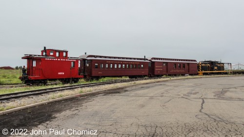 This twin-axle wooden caboose looks like something right out of a children's book illustration as it rides behind the consist of the afternoon dinner train.