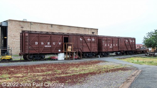 These vintage wooden Denver, Rio Grande, & Western box cars are used as storage sheds for the C&TSRR Antonito Depot.