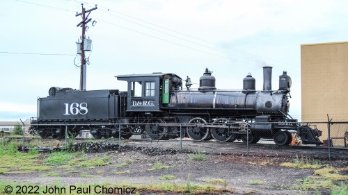 The C&TSRR #: 168 stands by as the #: 463 with the, "Antonito Limited", prepares to depart. The 168 will provide the power for the, "Dinner Train", which will depart Antonito at 2:30pm.