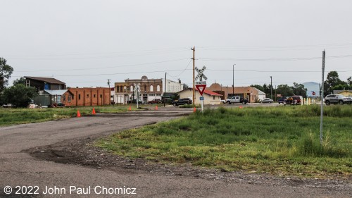 Usually, empty railroad crossings aren't much of a subject to photograph. This one is an exception as fans of Indiana Jones and the Last Crusade should recognize this from a scene which has a young Indiana Jones run across this crossing and into his childhood home directly across the street and behind me in the photograph. This crossing is in the town of Antonito, CO and is about a mile or so from the Cumbres and Toltec Scenic Railroad Depot. It is also about a block away from the actual Denver, Rio Grande, & Western Antonito Station.