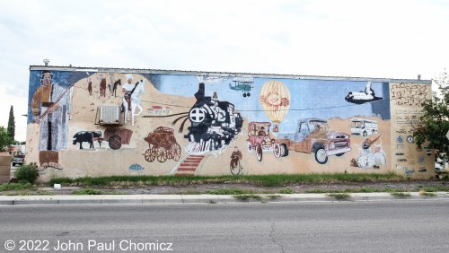 This mural was painted on the wall of a building right across the street from the railroad museum in Las Cruces, NM. Although the mural depicts all modes of transportation that were important during the various stages of the city history, the focal point seems to imply that the railroad, most notably the AT&SF, played the biggest role in shaping the history of the city.