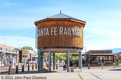 The water tower is the landmark of the redeveloped former AT&SF Railroad railyard in Santa Fe, NM. It is now a shopping/residential plaza that is centered around the plaza where the water tower stands. I don't know if this is a replica or an original structure as all the available information seems to focus on the redevelopment and does not go into detail about the former layout, structures, etc.