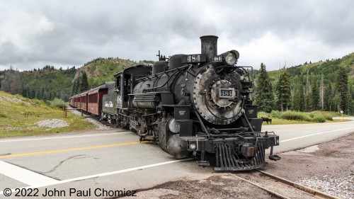 The Indiana Jones star pulls the Chama Limited across Route #: 17 in Colorado. In a few miles, it will cross back into New Mexico as it approaches its home terminal in Chama, NM.