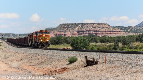 The problem with Abo Canyon is that the entire canyon is one beautiful photo opportunity for railfanning with not many places to safely stop along the narrow road with a lot of traffic. Here, I was able to find a private crossing to pull down into to catch this short westbound hi-gon train with a scenic mesa as a backdrop.