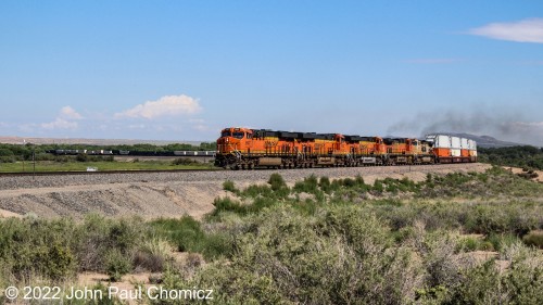 Now it's a BNSF eastbound doublestack that rounds the curve near the Rio Grande River in the Belen, NM suburb of Rio Grande Estates.