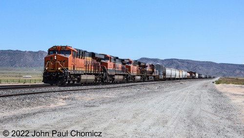 This westbound mixed freight was quite interesting in that it had a Kansas City Southern unit trailing with an interesting load behind it at the Route #: 47 crossing somewhere outside of Belen, NM.