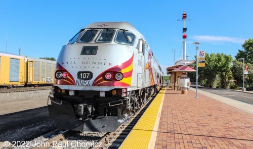 New Mexico Rail Runner #: 107 rests with a short commuter train at the line's southern terminus at Belen Station in Belen, NM.